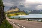 Norway, Lofoten. Road next to fjord and mountain landscape. Art Print